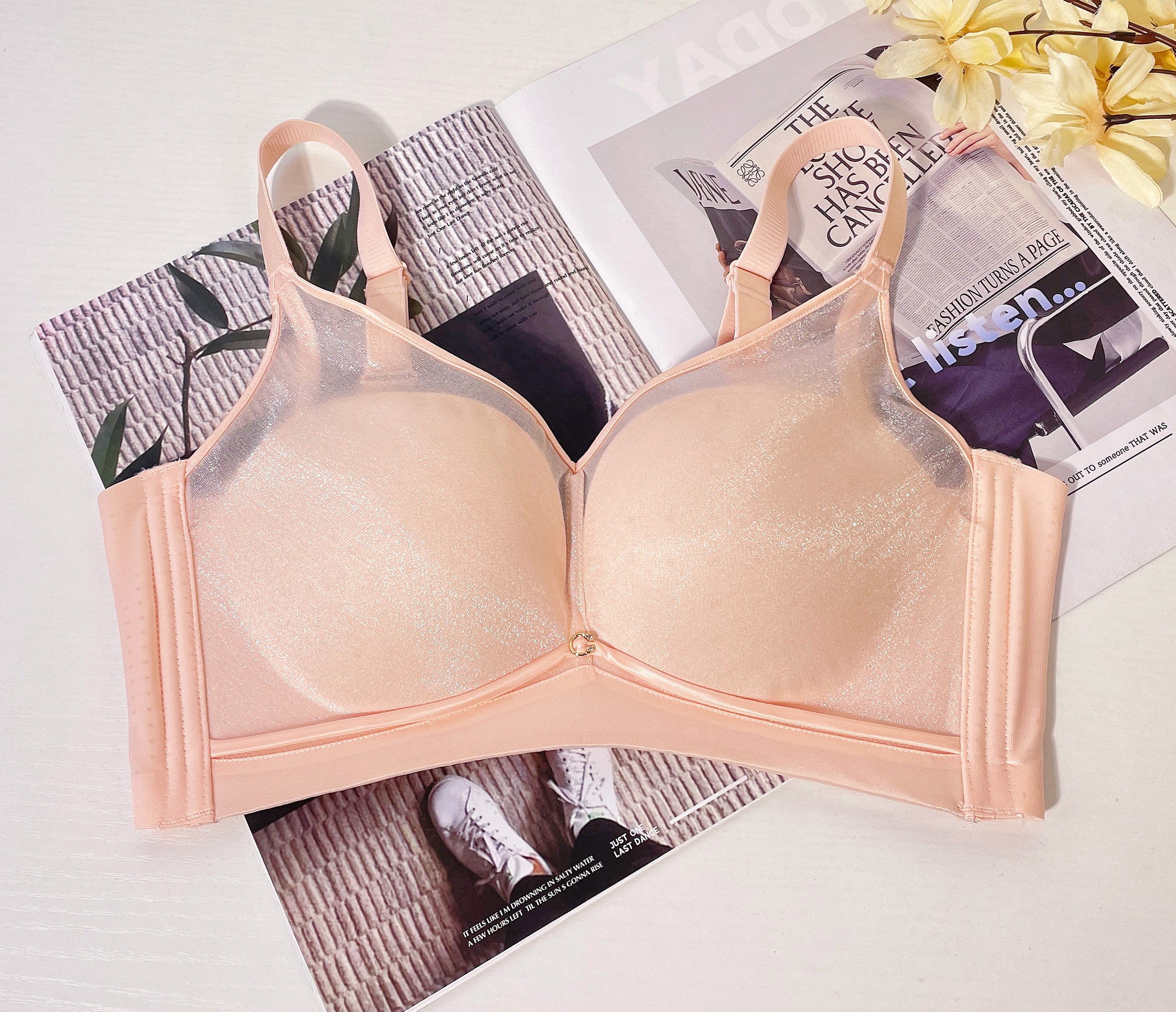 Angled view of grey wireless mesh contour bra highlighting wide smoothing sidebands