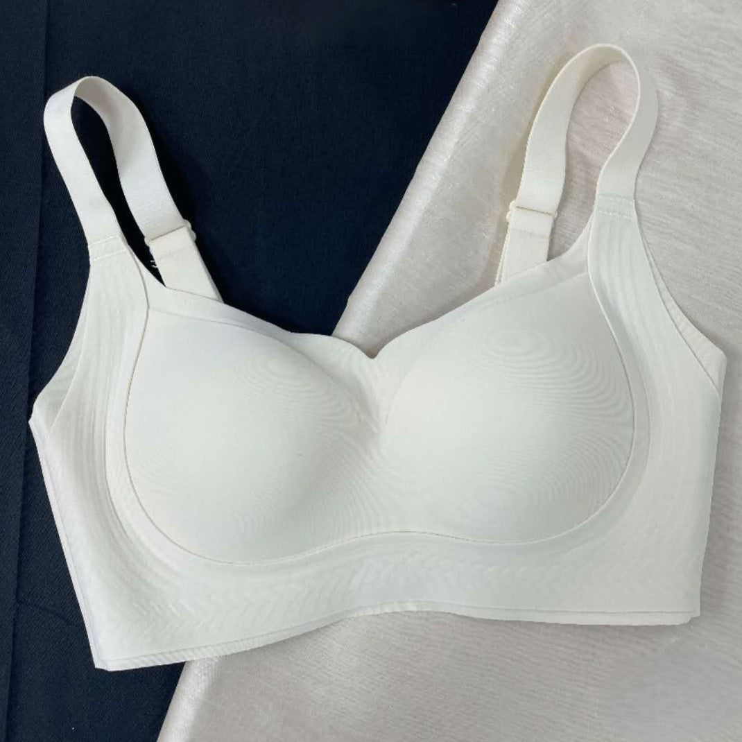 Angled view of white wireless seamless contour bra with rose essential oil-infused fabric
