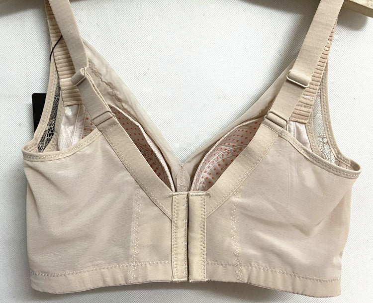 Back view of beige wireless minimizer contour bra showing hook-and-eye closure and adjustable straps