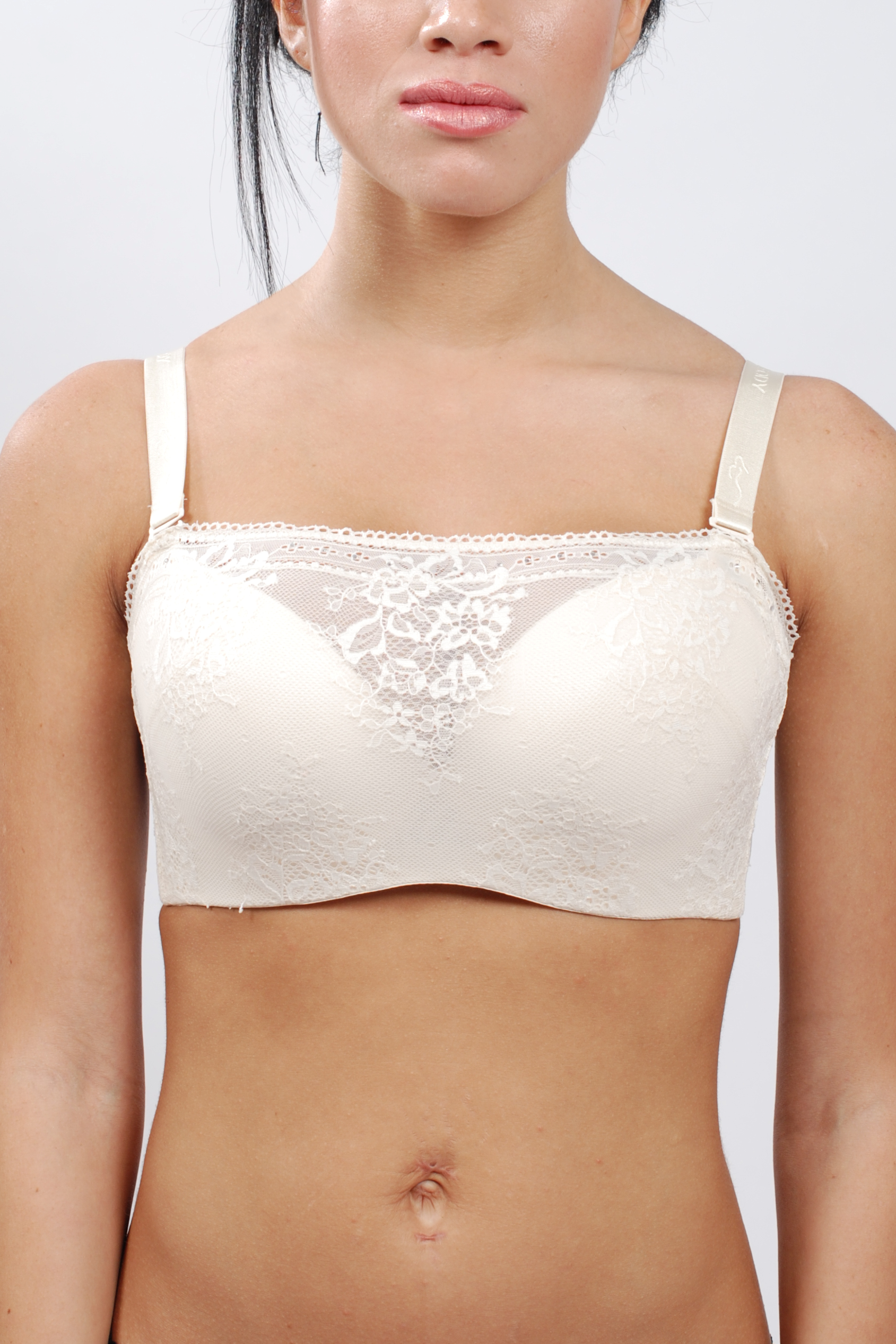 Side view of black lace bandeau contour bra showing wide back-smoothing bands