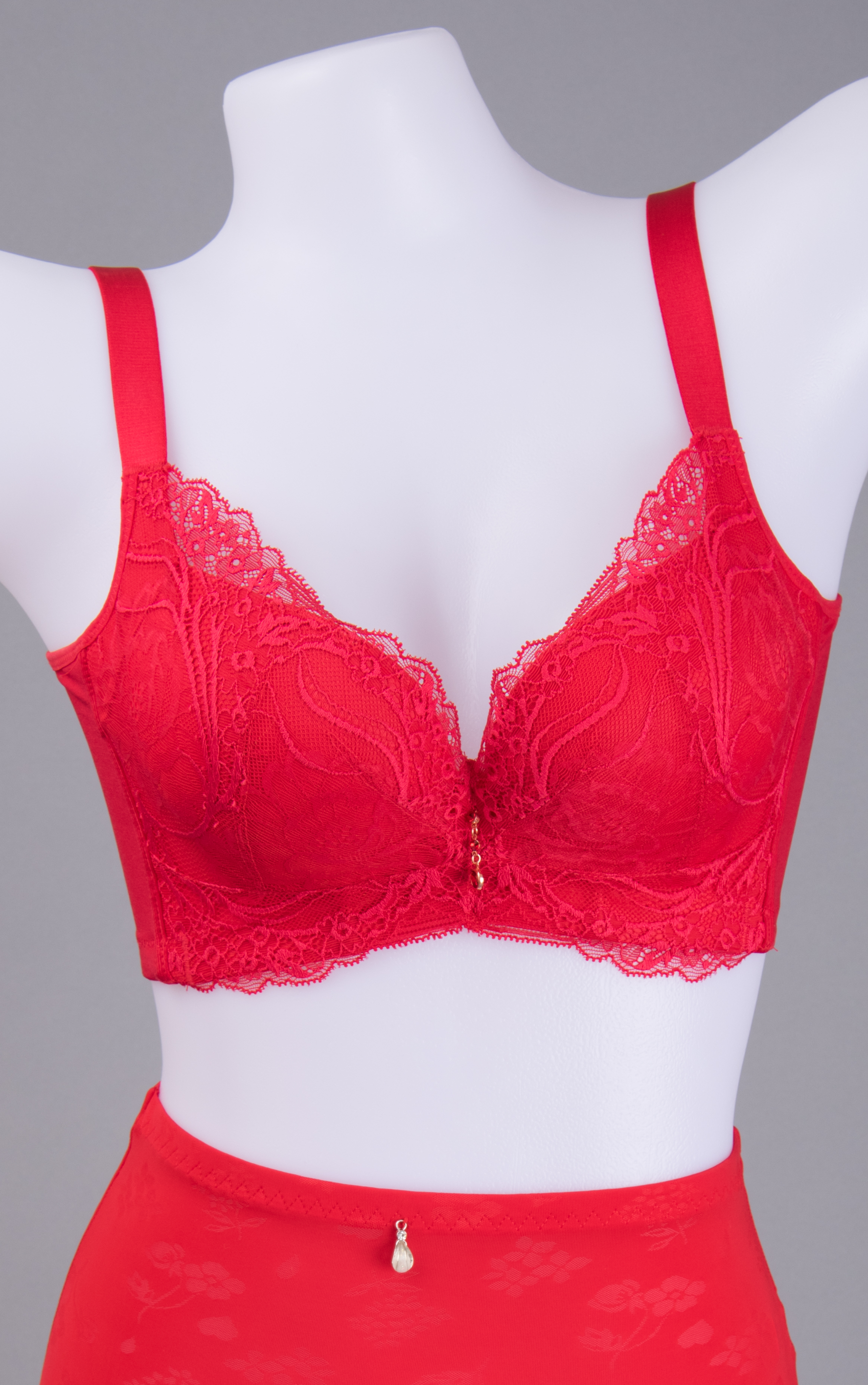 Side view of red lace underwire contour bra showing thick padded cup lift
