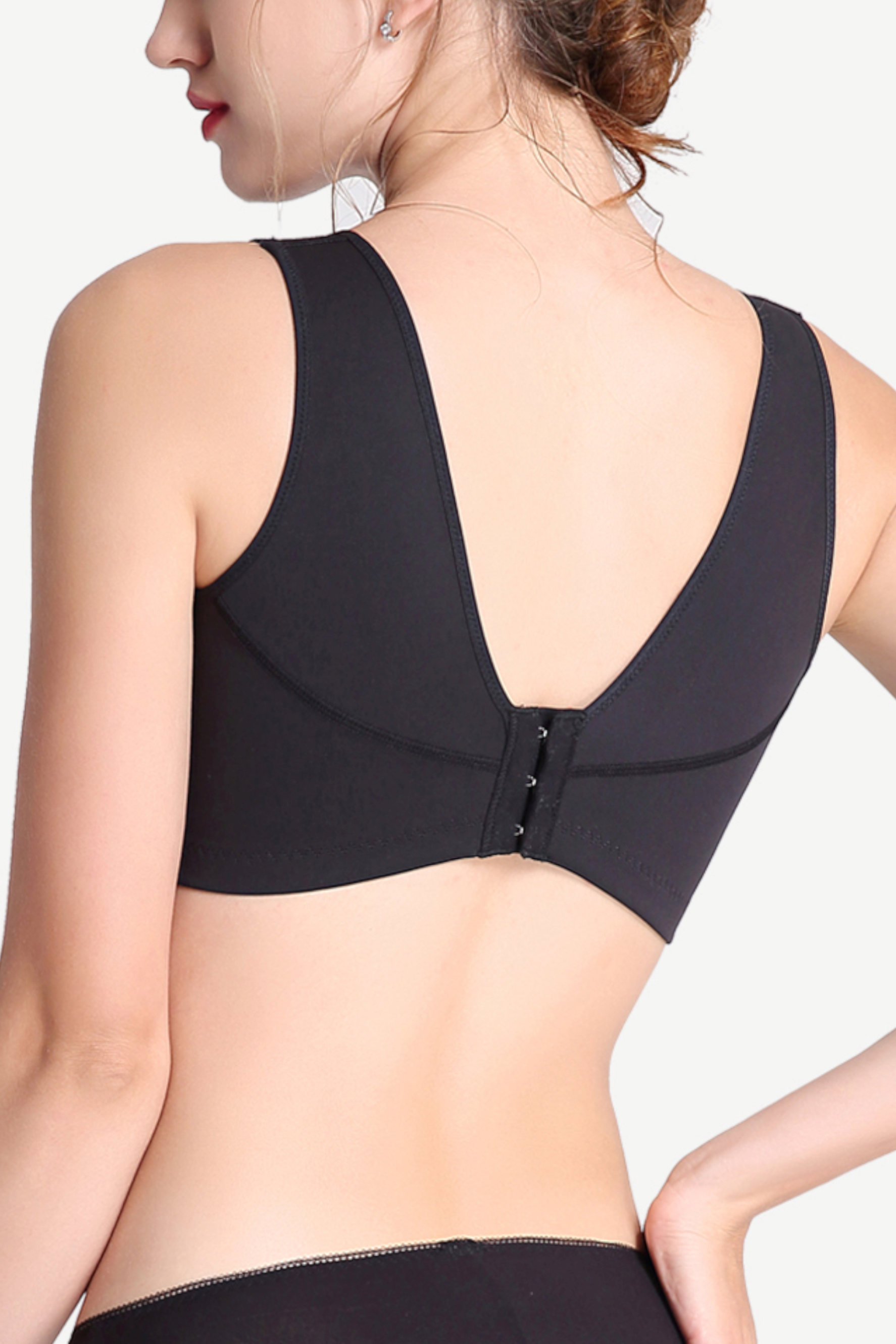 Side view of black wireless mesh sports contour bra showing breathable panels and supportive design