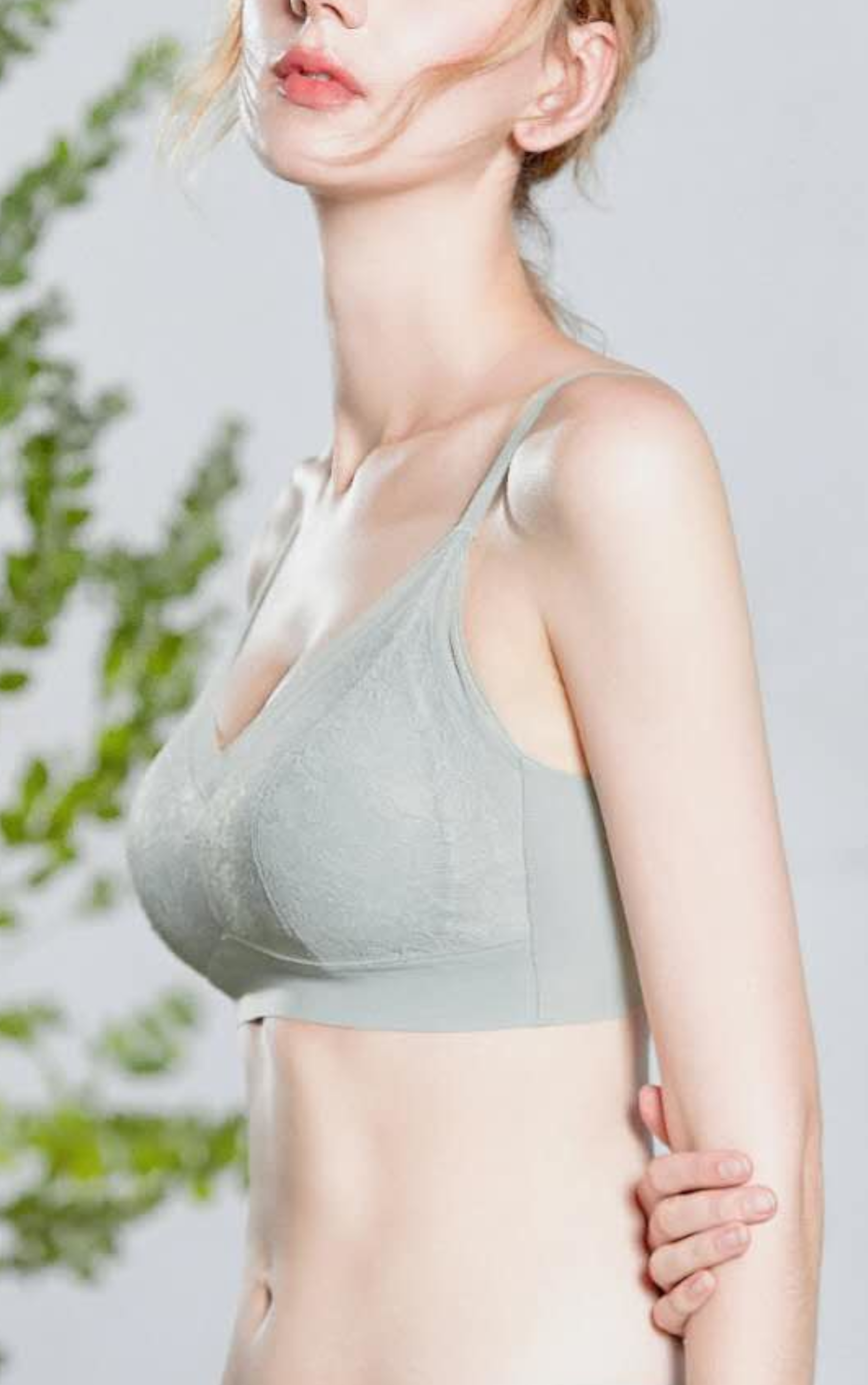 Side view of gray floral lace wireless contour bra showcasing non-marking underbust band