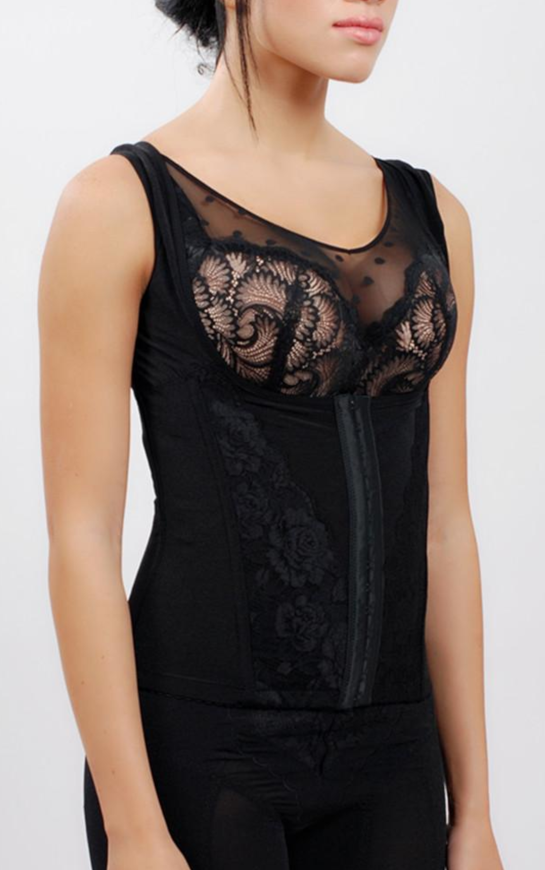 Side view of black waist cincher shapewear showing firm tummy control panel