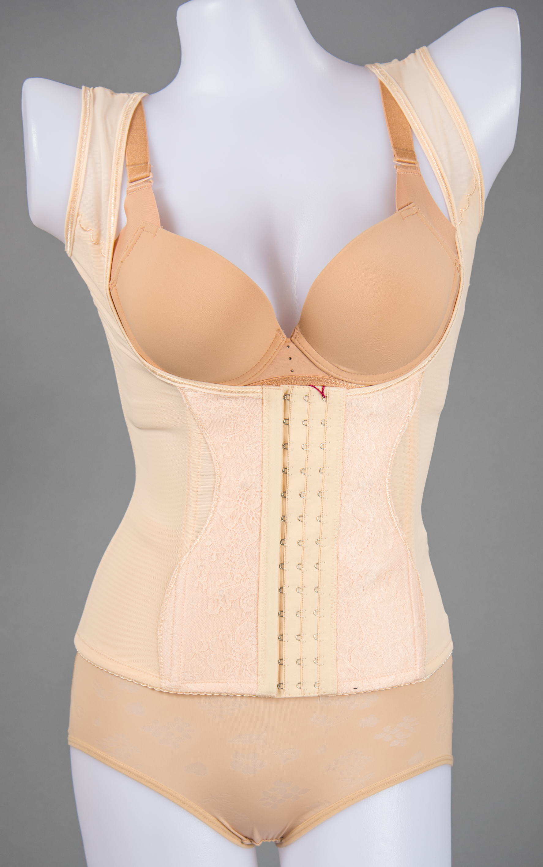 Side view of black camisole corset shapewear showing firm tummy control panel
