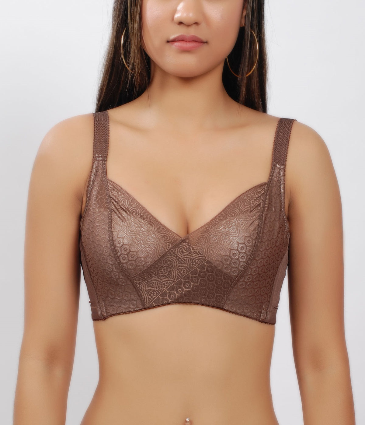 Woman wearing a coffee (brown) wireless bra with wide straps and moisture-wicking cotton cups.