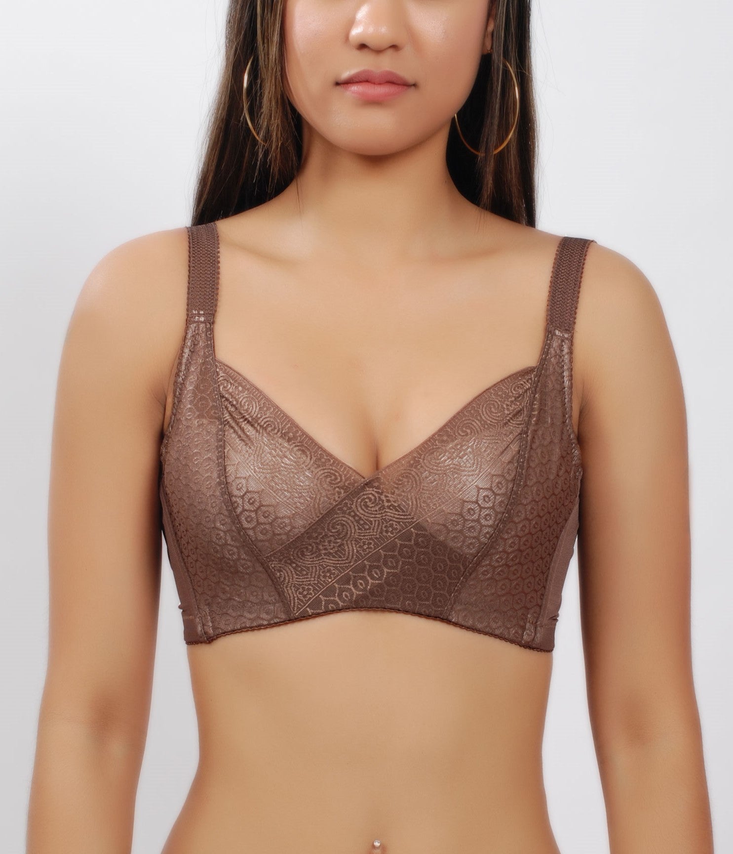 Woman wearing a coffee (brown) wireless bra with wide straps and moisture-wicking cotton cups.