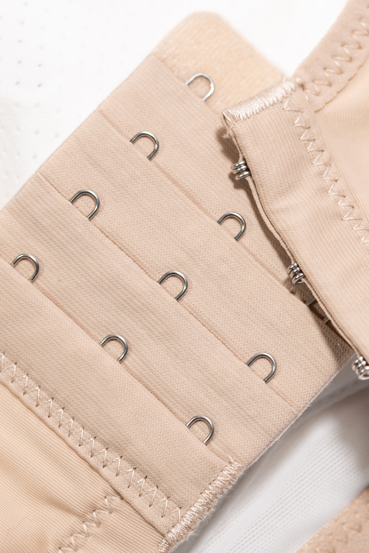 Angled view of pink wireless contour bra highlighting V-neck neckline and seamless cups