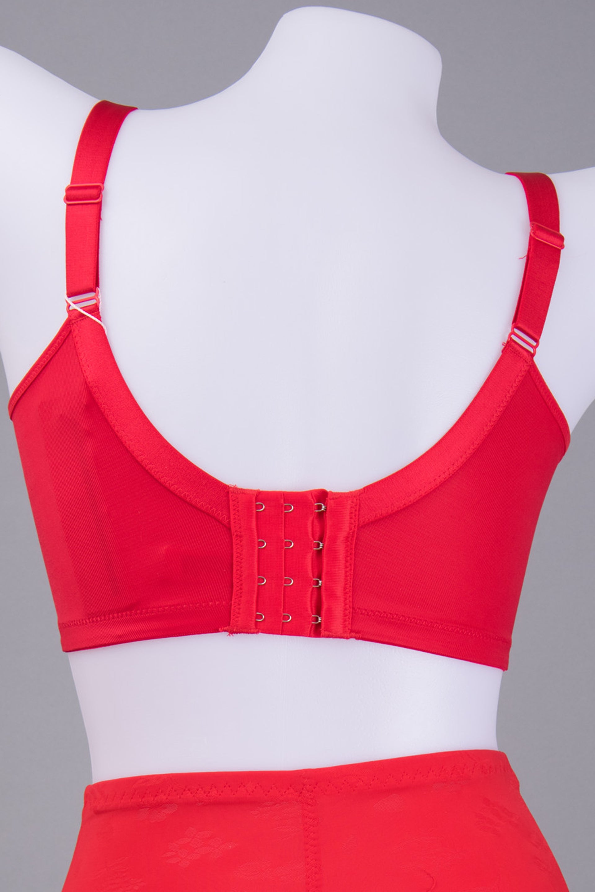 Angled view of red thick cup lace contour bra showing full shaping silhouette