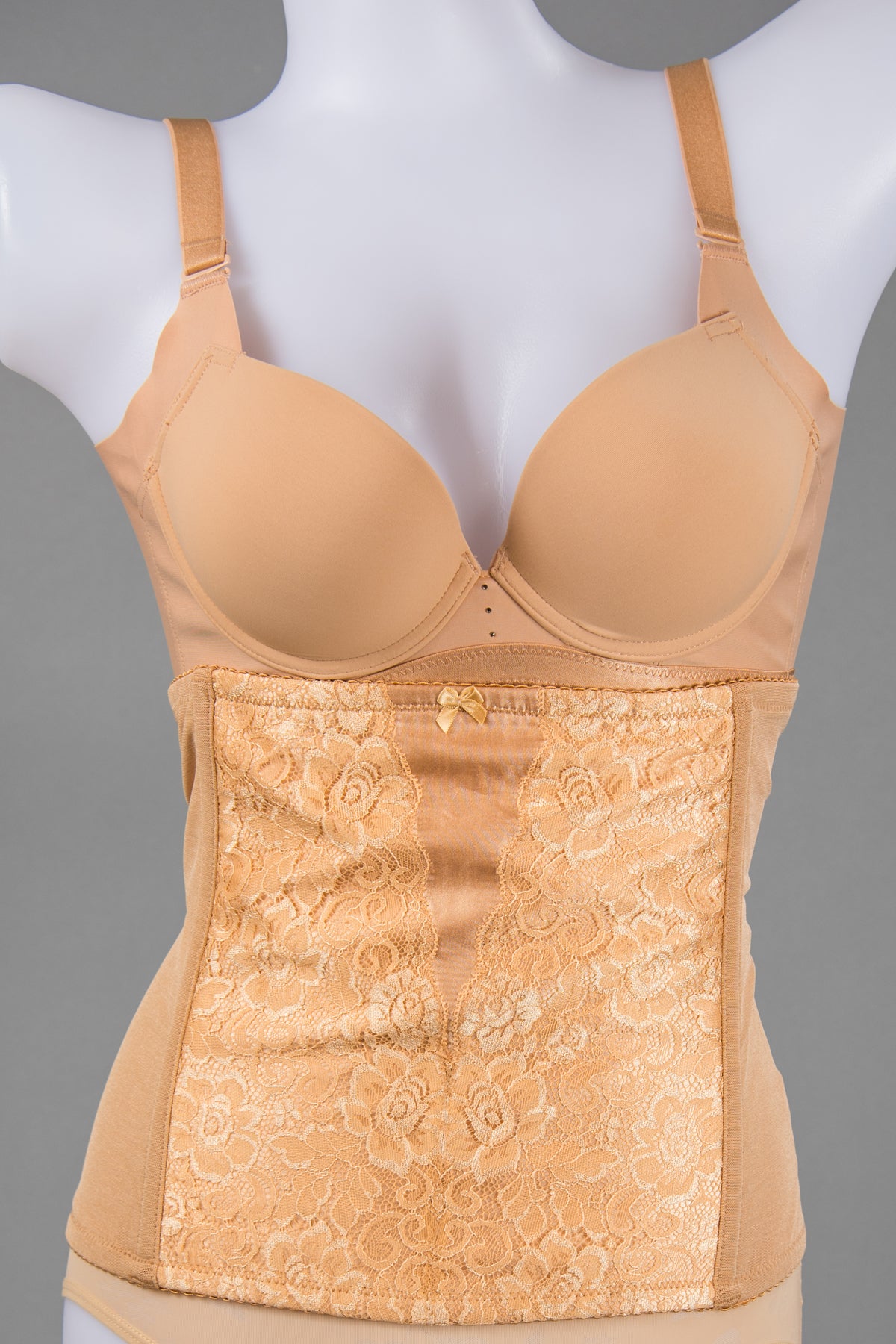 Back view of beige waist trainer corset shapewear with adjustable closure