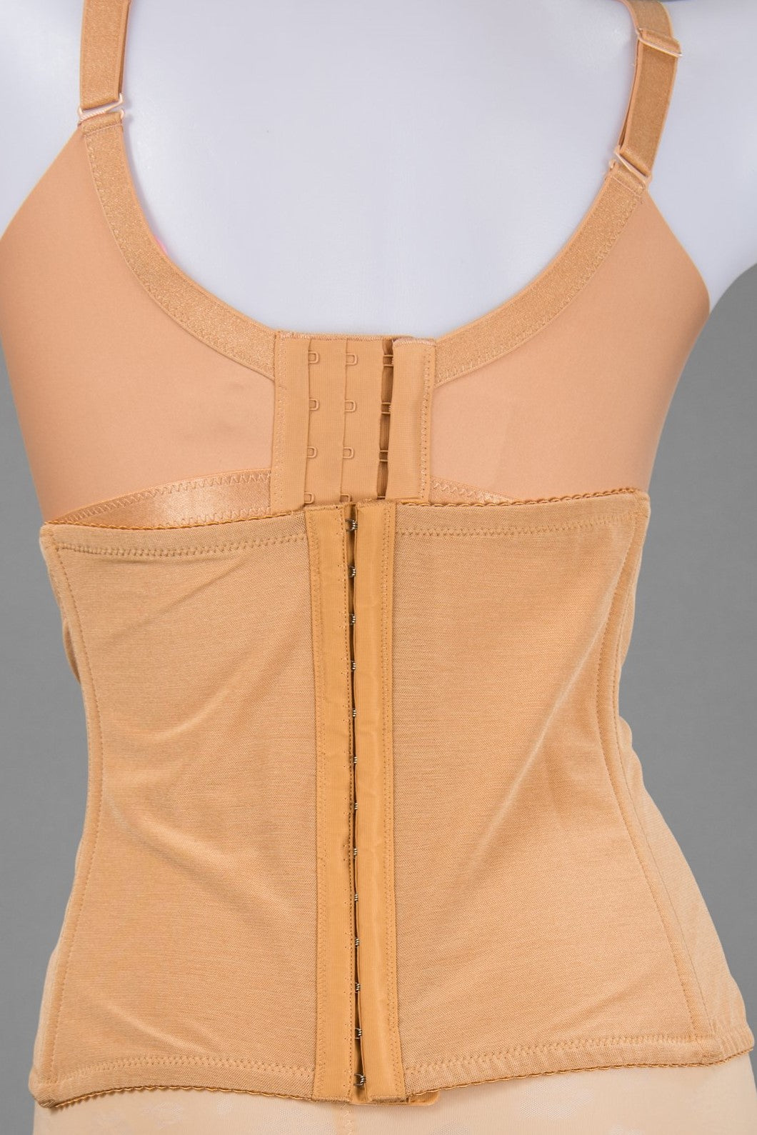 Side view of beige waist cincher corset shapewear showing slimming profile