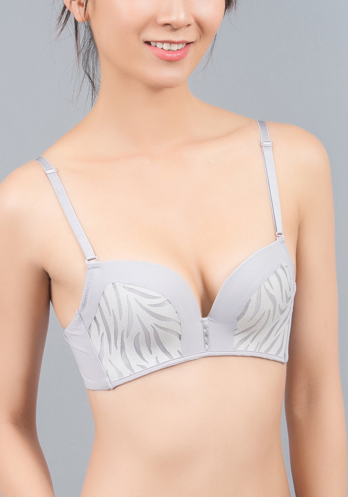 Detail view of silk lining and leopard print on black push-up convertible contour bra