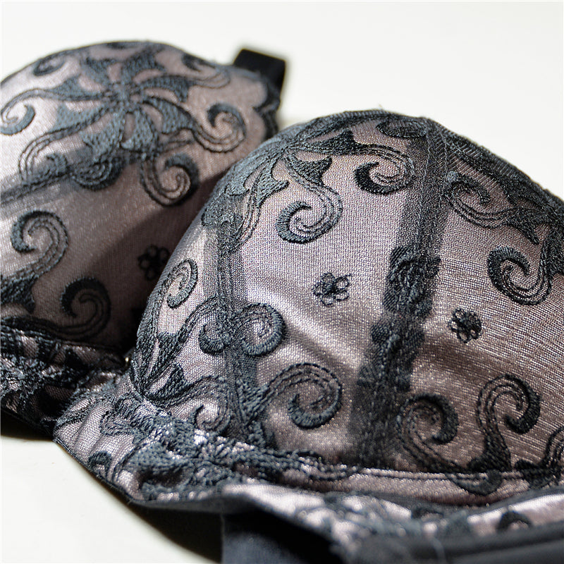 Detail view of scalloped lace edge on blue push-up contour bra cup