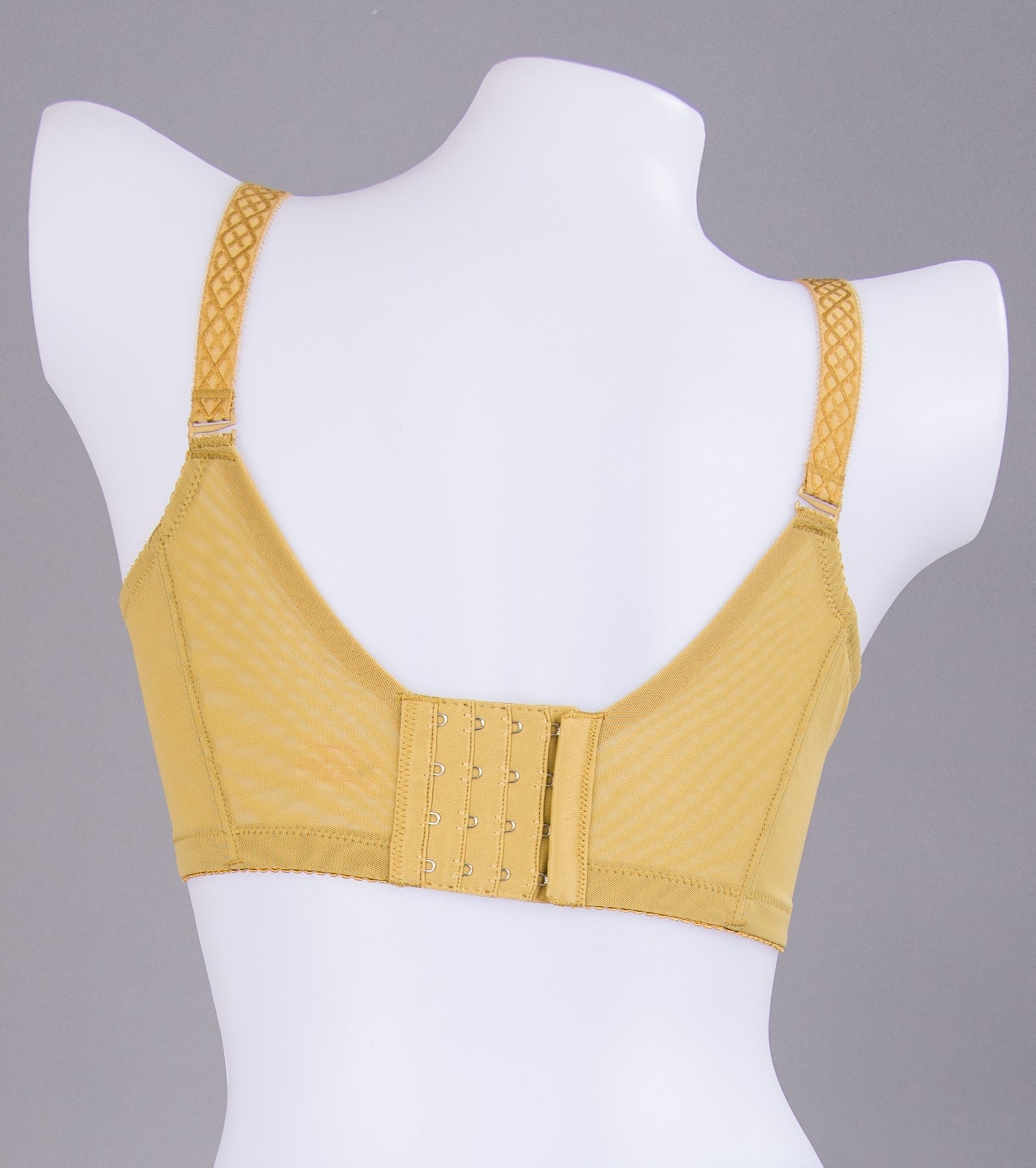 Detail view of green crochet lace contour bra showing exquisite floral embroidery pattern