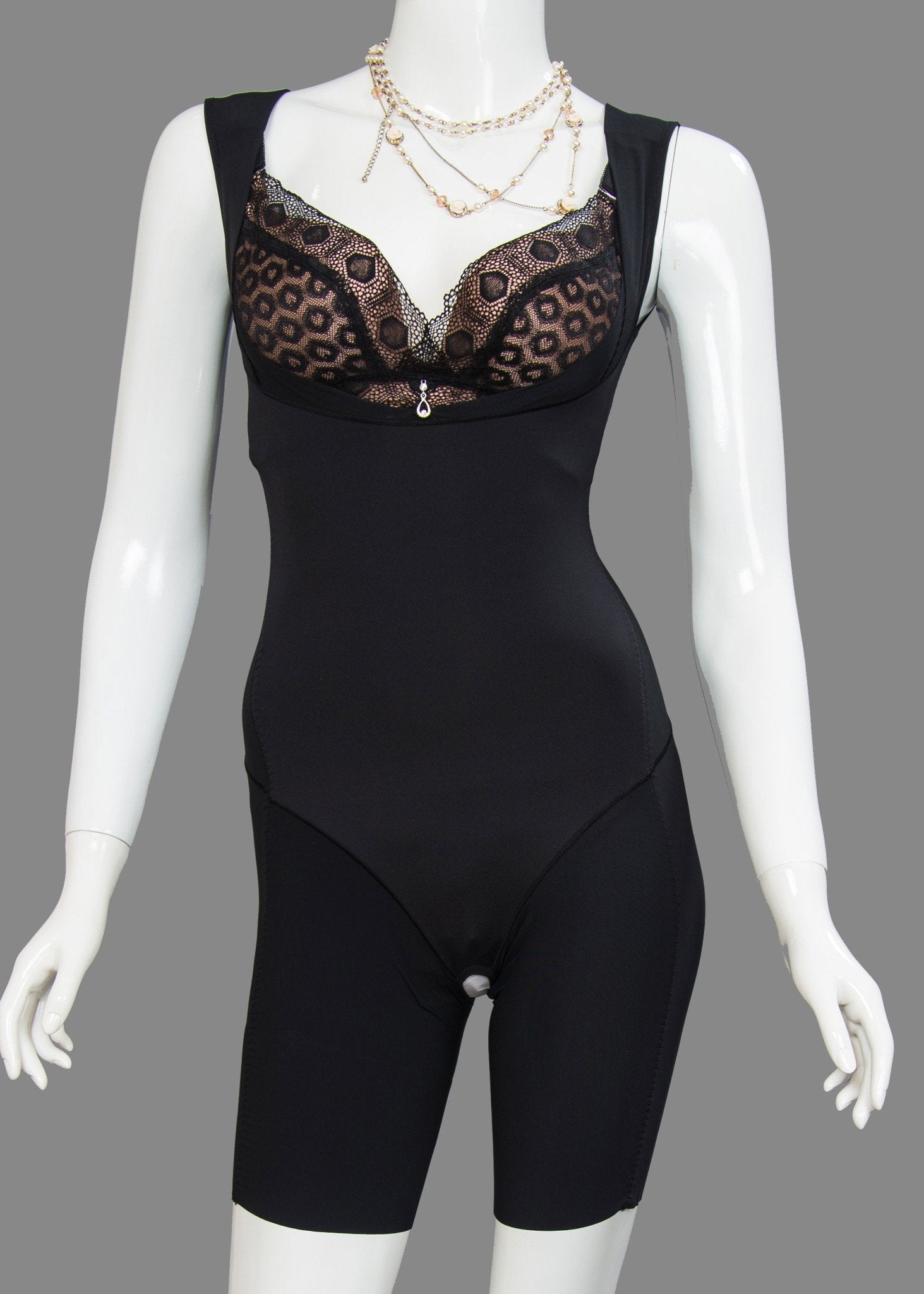 Detail view of black Intelligent Curve shapewear bodysuit highlighting power tummy control panel