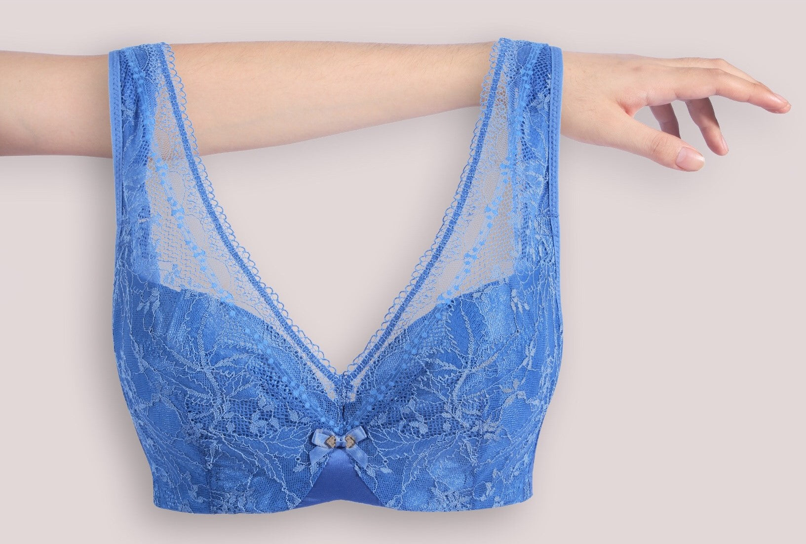 Back view of red lace minimizer contour bra highlighting wide straps and hook closure