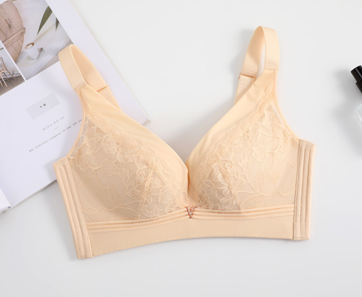 Front view of a beige wireless lace push-up bra, showcasing its breathable cotton cups, elegant lace design, and V-shaped detail.